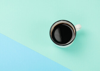 Cup of coffee on color background.
