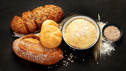Bread assortment on dark background.