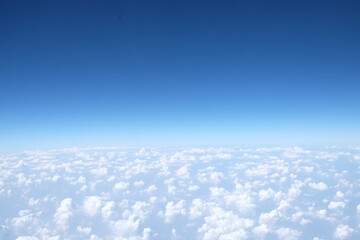 Fototapeta na wymiar The sky is blue and fluffy clouds background