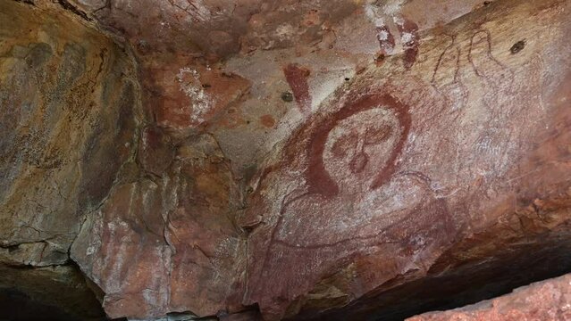Wandjina dreamtime images a cloud and rain spirits from Australian Aboriginal mythology painted on rock galleries in a cave in Kimberley Western Australia. 