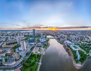 Yekaterinburg city with Buildings of Regional Government and Parliament, Dramatic Theatre, Iset Tower, Yeltsin Center, panoramic view at summer sunset.