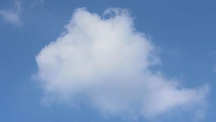 white clouds between blue skies