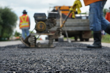 Blurred image of pavement repair work.