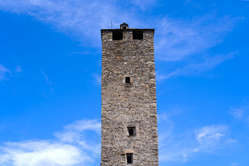 Fototapeta na wymiar Scenic view of Unesco world heritage castle Castelgrande at City of Bellinzona, Canton Ticino, on a blue cloudy summer day. Photo taken July 4th, 2022, Bellinzona, Switzerland.