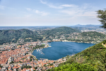 Naklejka na ściany i meble Lake Como, Italy - July 4, 2022: Aerial and lakeside views of the old town of Lake Como, Italy 