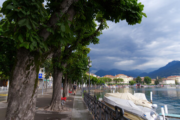 Scenic view of bay of Lake Lugano, Canton Ticino, on a cloudy summer day. Photo taken July 4th, 2022, Lugano, Switzerland.