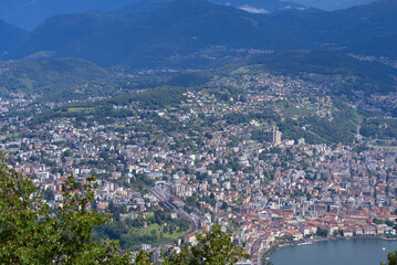 Aerial view of City of Lugano seen from local mountain San Salvatore on a sunny summer day. Photo taken July 4th, 2022, Lugano, Switzerland.