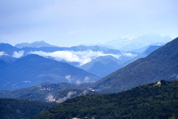Aerial scenic view over region of Lugano, Canton Ticino, on a cloudy summer day. Photo taken July 4th, 2022, Lugano, Switzerland.