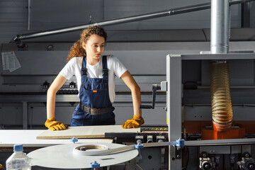 Female carpenter working in workshop