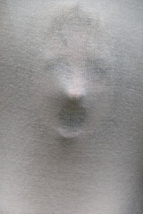 Fototapeta premium halloween face of screaming woman in fear behind transparent fabric, cloth as ghost