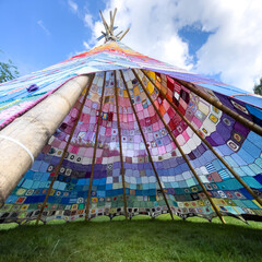 In Brilon, Germany there is a tent made of knitted wool.  It symbolizes the linking of people in a...