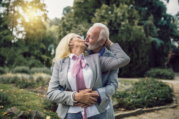 Portrait of beautiful senior couple posing in the park