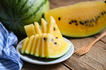 Yellow watermelon slice on white plate background, Closeup sweet watermelon slices pieces fresh watermelon tropical summer fruit