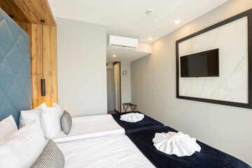 Fototapeta na wymiar Interior of a double bed hotel bedroom