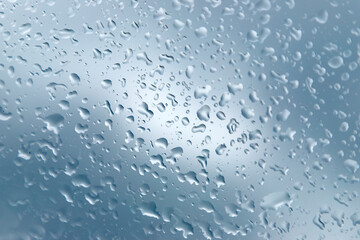 Close up of a window with raindrops.