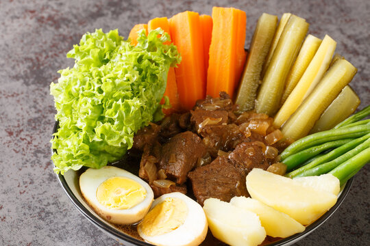 Selat Solo. Javanese style beef steak, popular in Solo Central Java closeup in the bowl on the table. Horizontal