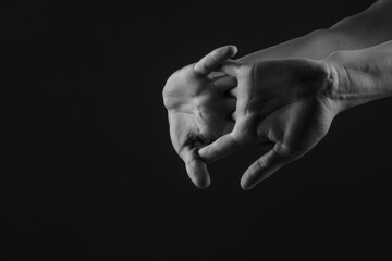 close-up hand massage on a dark background