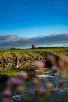 Beautiful shot of the Classiebawn Castle on a beautiful mountain