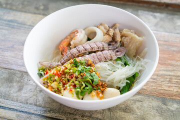 spicy seafood noodles bowl in Thai style