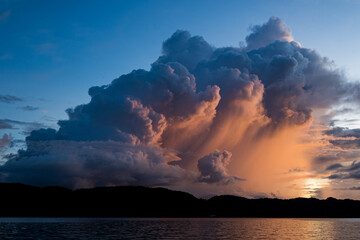 Naklejka na ściany i meble Sunset in Palau. Clouds developing. 