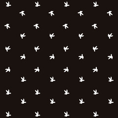 Bird shape pattern on black background, seamless.