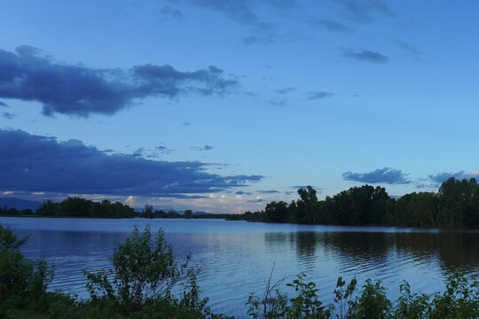 River, sky and clouds in the evening before sunset