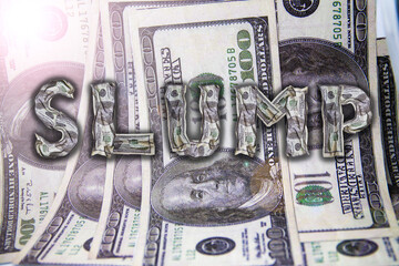 Word Slump made of crumpled dollars on the background of money