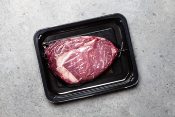 Vacuum packed beef steak. Raw ribeye steak