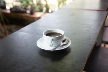 black coffe hot coffee on wooden table