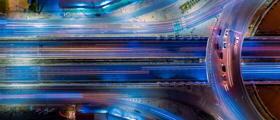 Expressway top view, Road traffic an important infrastructure,car traffic transportation above intersection road in city night, aerial view cityscape of advanced innovation, financial technology	