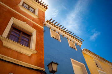 Colored facades of the houses of the historic center of the city of Mula, in the Region of Murcia, Spain.