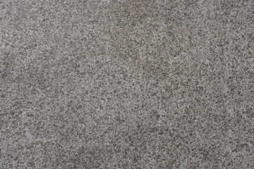 Polished stone, interestingly textured image background consisting of gray polished stone. Copy space for your design. Web banner. 
