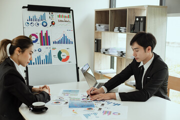 Technology and financial advisory services concert. Business teamwork and working on digital laptop computer with advisor showing plan of investment to clients at table office. Digital marketing.