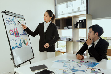 Technology and financial advisory services concert. Business teamwork and working on digital laptop computer with advisor showing plan of investment to clients at table office. Digital marketing.