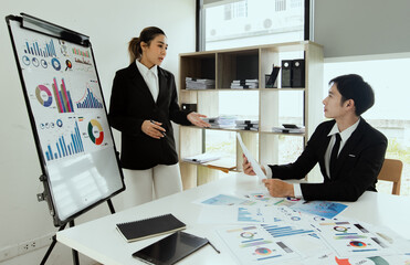 Technology and financial advisory services concert. Business teamwork and working on digital laptop computer with advisor showing plan of investment to clients at table office. Digital marketing.