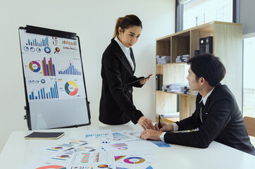 Technology and financial advisory services concert. Business teamwork and working on digital laptop computer with advisor showing plan of investment to clients at table office. Digital marketing.