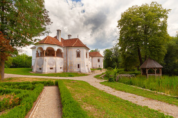 Fototapeta na wymiar Traditional mansion in Transylvania surrounded by green garden