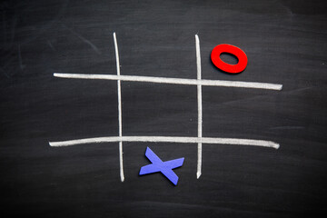 Abstract Tic Tac Toe Game Competition with Wood Alphabet letters. XO Win Challenge Concept on black...