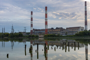 Fototapeta na wymiar old factory stands near the lake