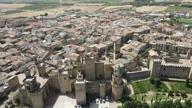 A beautifully warm sunny day in the Spanish town of Olite, rising reveal.