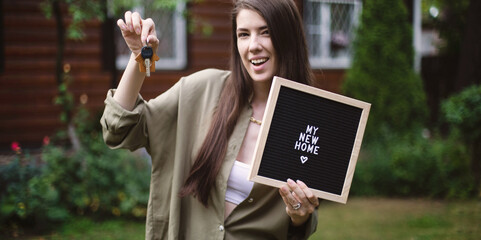 Young family smiling mortgage house loan accepted. Brunette dark hair woman happy with new home...