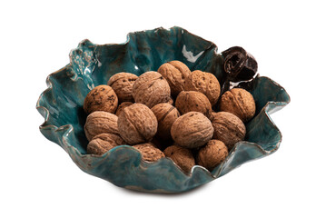 Hand made bowl full of fresh walnuts