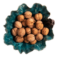 Hand made bowl full of fresh walnuts