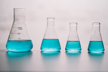 In laboratory contains tube, beaker, liquid, virus and samples. Liquid substance in equipment glassware for chemistry biology. development for analysis scientific. healthcare and medical concept.