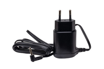 Closeup of a black AC to DC power adapter or charger for a rechargeable beard and hair clipper...