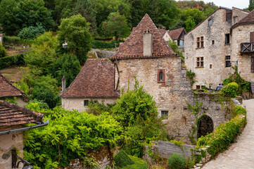 Fototapeta na wymiar France, Lot, Saint-Cirq-Lapopie, labelled Les Plus Beaux Villages de France, 15th century fortified Roman church. High quality photo