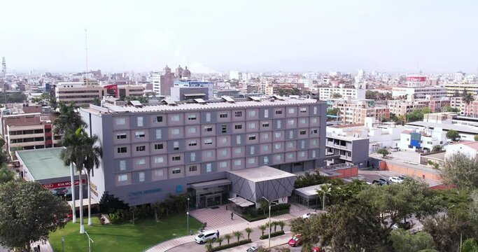 Beautiful large zoom in drone shot of the famous and elegant "Casa Andina" hotel in Chiclayo, Peru during the day.