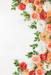 Autumn flowers composition made of beautiful roses and ranunculus flowers on light backdrop. Floristic decoration. Natural floral background.