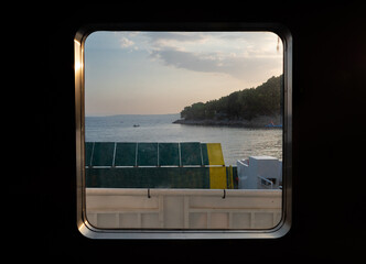 view from the window of a ferry to the sea