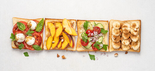 Set of various toasts on white background, top view. Mozzarella bruschetta, Hummus toast, peanut...